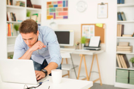 Man in home office on computer